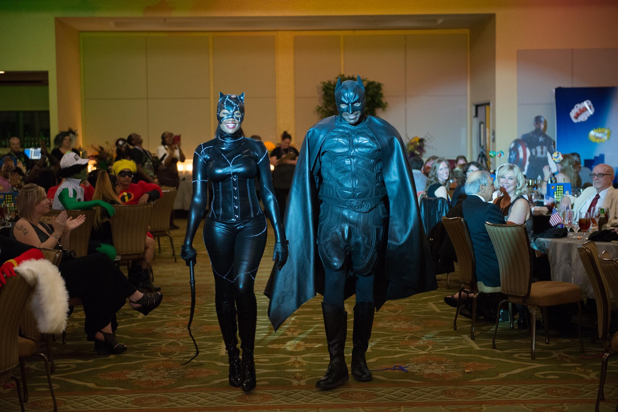 Tech. Sgt. Amber Davis, 81st Diagnostics and Therapeutics Squadron diagnostic imaging NCO in charge, and her husband, Master Sgt. Michael Davis, 81st Medical Operations Squadron internal medicine flight chief, win third place in a costume contest during the 28th Annual Krewe of Medics Mardi Gras Ball at the Bay Breeze Event Center Jan. 30, 2016, Keesler Air Force Base, Miss. The Krewe of Medics hosts a yearly ball to give military personnel assigned to the Keesler Medical Center a taste of the Gulf Coast and an opportunity to experience a traditional Mardi Gras. The theme of this year's ball was superheroes and villains. (U.S. Air Force photo by Marie Floyd)