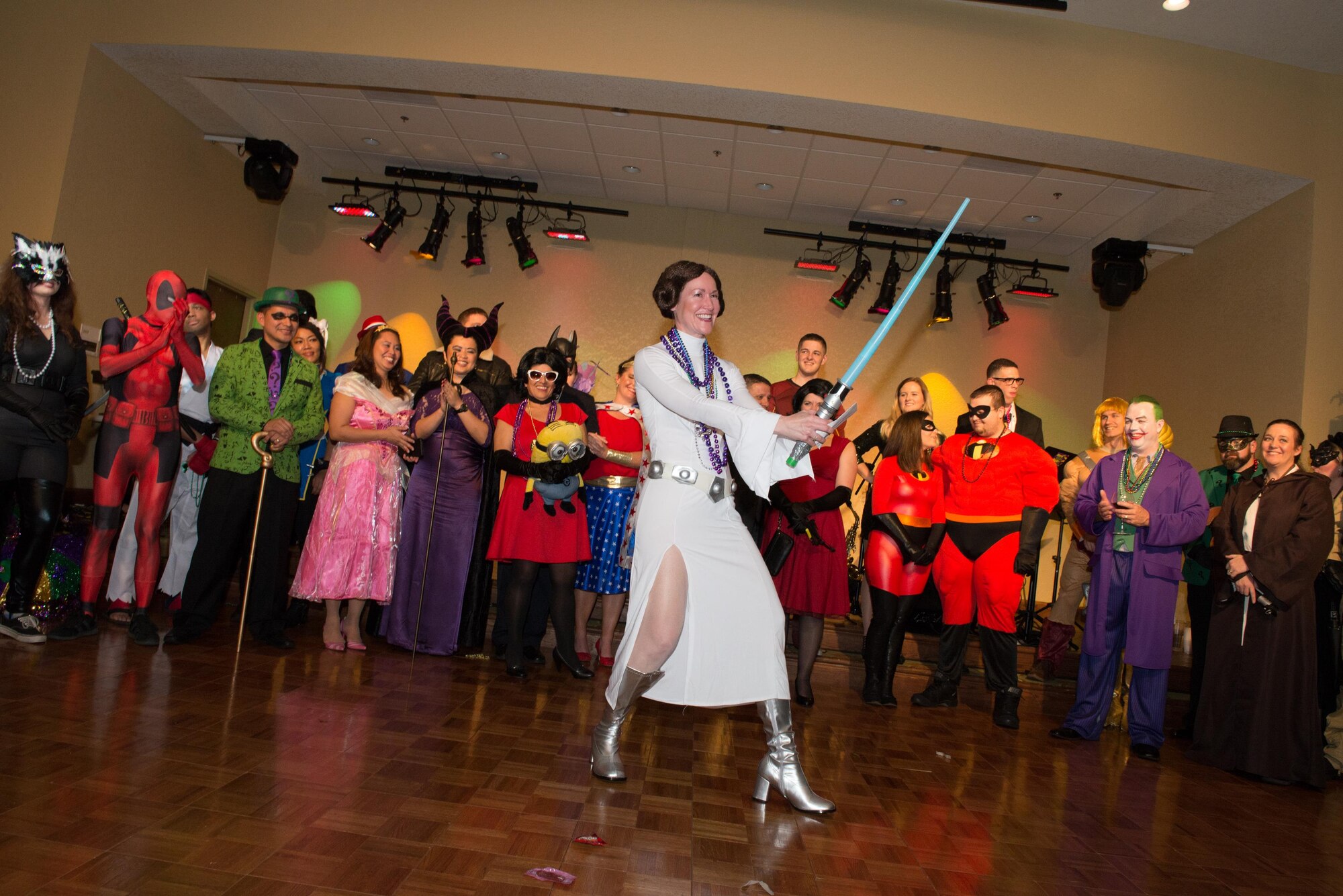 Col. Susan Airola-Skully, 81st Mission Support Group commander, wins second place in a costume contest held during the 28th Annual Krewe of Medics Mardi Gras Ball at the Bay Breeze Event Center Jan. 30, 2016, Keesler Air Force Base, Miss. The Krewe of Medics hosts a yearly ball to give military personnel assigned to the Keesler Medical Center a taste of the Gulf Coast and an opportunity to experience a traditional Mardi Gras. The theme for this year's ball was superheroes and villains. (U.S. Air Force photo by Marie Floyd)
