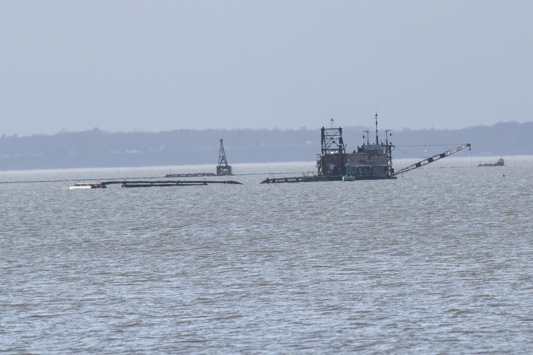 Jamestown, Va. -- The crew of a Cottrell Contracting Corporation Dredge  works to remove shoals from the James River federal navigation channel near Jamestown Virginia, Feb. 2 2016. The river plays a role in the economies of Richmond and Hopewell, providing a navigation channel of 25 feet deep for ships to move goods to and from the inland ports. (U.S. Army photo/Patrick Bloodgood)


