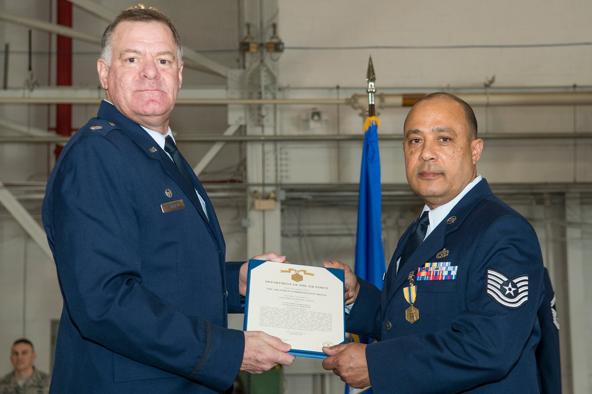 U.S. Air Force Lt. Col. Leo Kamphaus, 307th Maintenance Group commander, presents the Air Force Commendation Medal to Tech. Sgt. Dwight Wilson during a Commander’s Call on Jan. 31, 2016, Barksdale Air Force Base, La. Wilson received the award for outstanding achievement while assigned to the 307th Maintenance Squadron from Mar. 1, 2013 to Mar. 1, 2014. (U.S. Air Force photo by Master Sgt. Greg Steele/Released)