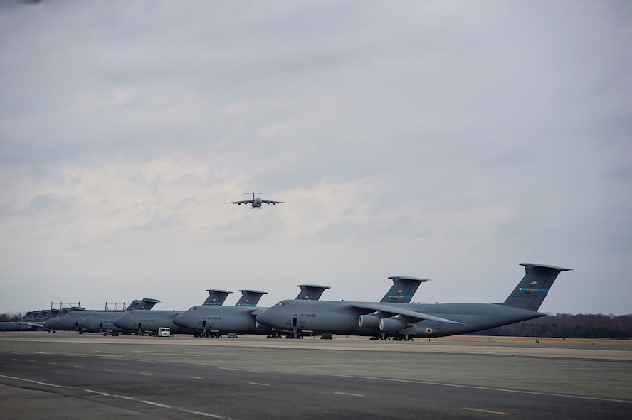 Col. Jonathan Philebaum, 512th Operations Group commander, takes his "fini-flight" at the 512th Airlift Wing, Feb. 3, 2016, at Dover Air Force Base, Del. Philebaum will be taking command of the 932nd Airlift Wing at Scott Air Force Base, Illinois, on February 7. (U.S. Air Force Photo by Capt. Bernie Kale)