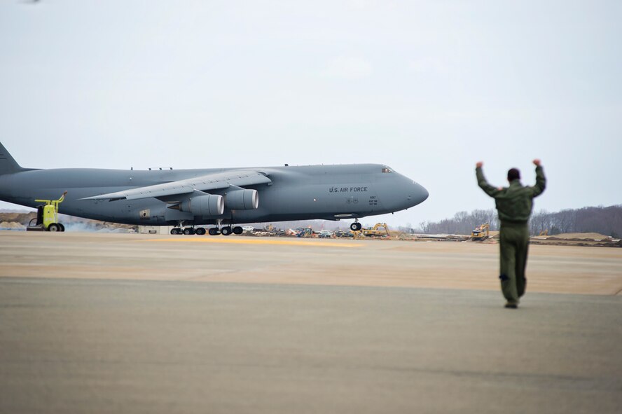 Col. Jonathan Philebaum, 512th Operations Group commander, takes his "fini-flight" at the 512th Airlift Wing, Feb. 3, 2016, at Dover Air Force Base, Del. Philebaum will be taking command of the 932nd Airlift Wing at Scott Air Force Base, Illinois, on February 7. (U.S. Air Force Photo by Capt. Bernie Kale)