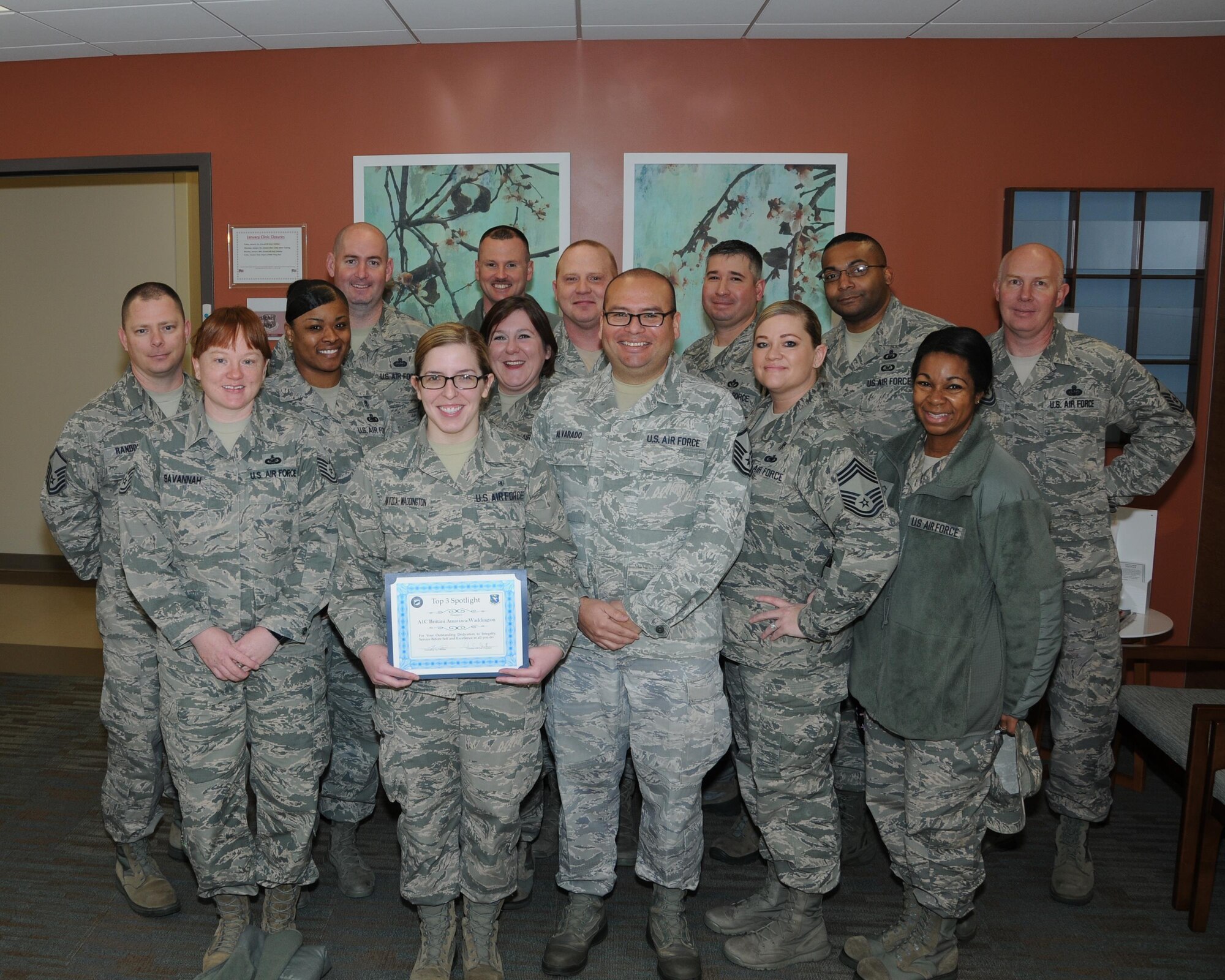 Airman 1st Class Brittani Waddington, 14th Medical Operations Squadron, poses for a photo with members of the Top 3 Organization at the 14th Medical Group. Waddington was chosen for the January Top 3 Spotlight for not only excellent job performance, but demonstrating the whole Airman concept with her involvement on base and in the community. She dedicated 16 hours toward base and community outreach to include: Event Coordinator for Airman’s Council, AFSA member, eight hours towards 434-RIDE program, two hours at Trinity Nursing home and four hours working with the Humane Society, helping to build base and community relations. 