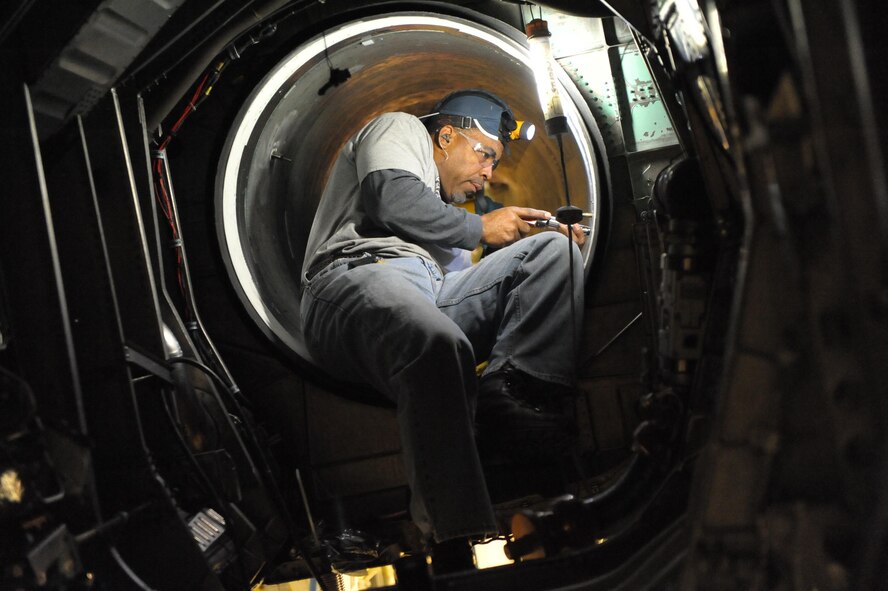 Anthony Farrow, of the 561st Aircraft Maintenance Squadron Production Support, changes intake fasteners on an F-15 Eagle during programmed depot maintenance at Robins Air Force Base, Ga. Thanks, in part, to the diligence of the base’s employees, F-15 pilots are able to provide aerial security above Levi’s Stadium in Santa Clara, Calif., during Super Bowl 50 on Feb. 7, 2016. (U.S. Air Force photo/Ray Crayton)