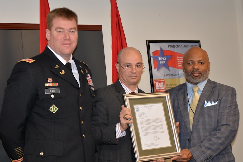 The Wright-Patt Resident Area Office employees, Dayton, Ohio, are recognized as the third Corps of Engineers certified site for Voluntary Protection Programs. Leonard Litton, acting director, Office of the Under Secretary for Personnel and Readiness (center), is pictured with Col. Christopher Beck and Kevin Jefferson, construction, Wright-Patt. VPP is a recognition for employers and workers who have implemented safety and health management systems and have maintained injury and illness rates below national Bureau of Labor Statistics averages.
