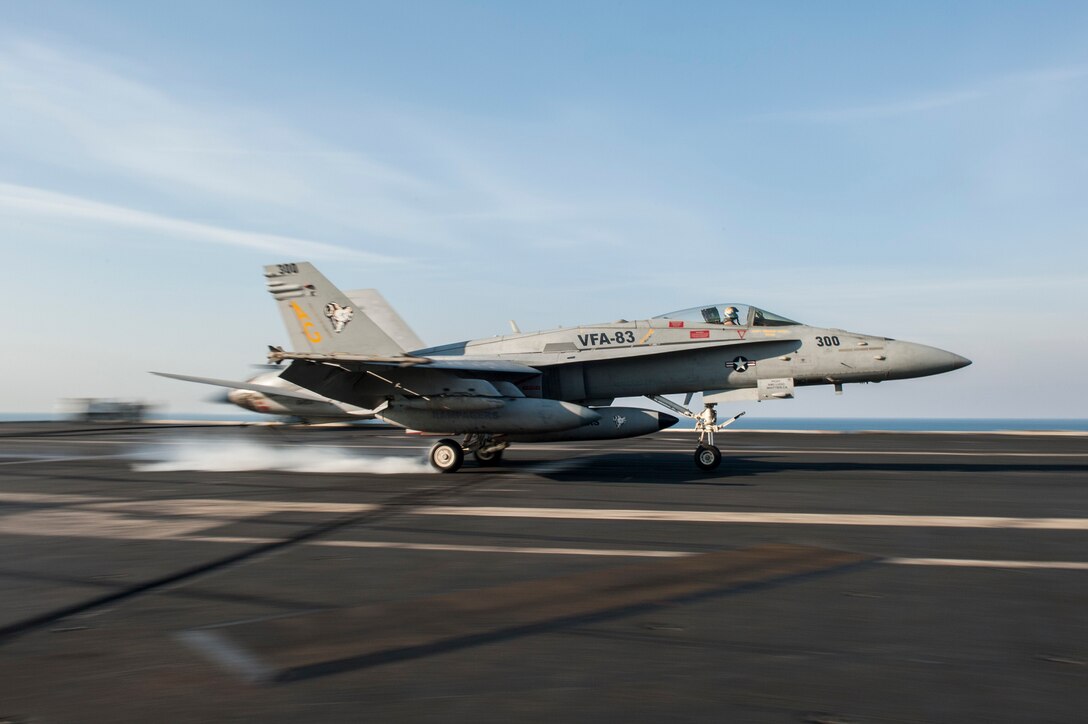 A U.S. Navy F/A-18C Hornet, assigned to Strike Fighter Squadron 83, lands on the flight deck of aircraft carrier USS Harry S. Truman at sea in the Persian Gulf, Feb. 2, 2016. The Truman Carrier Strike Group is deployed in support of Operation Inherent Resolve. U.S. Navy photo by Seaman Lindsay A. Preston