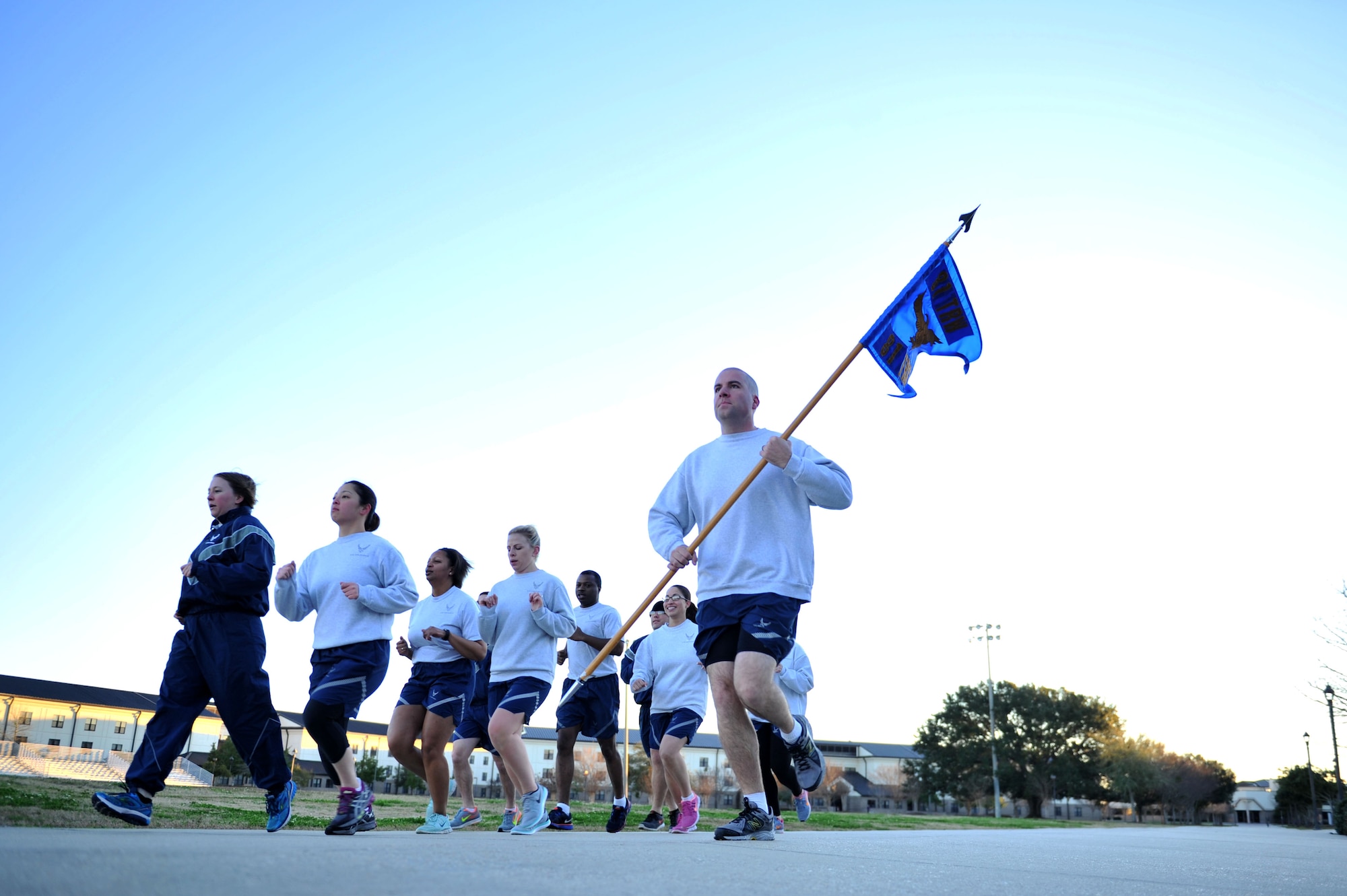 Tech. Sgt. Kyle Mullen, 81st Training Support Squadron military training leader course instructor, leads a military training leader course physical training session around the 81st Training Group parade field Feb. 4, 2016, Keesler Air Force Base, Miss. NCOs selected via the Developmental Special Duty program attend the nine-day course, formerly based out of Joint Base San Antonio-Lackland, Texas, in order to mentor, train and lead Airmen in technical training as MTLs. (U.S. Air Force photo by Senior Airman Duncan McElroy)