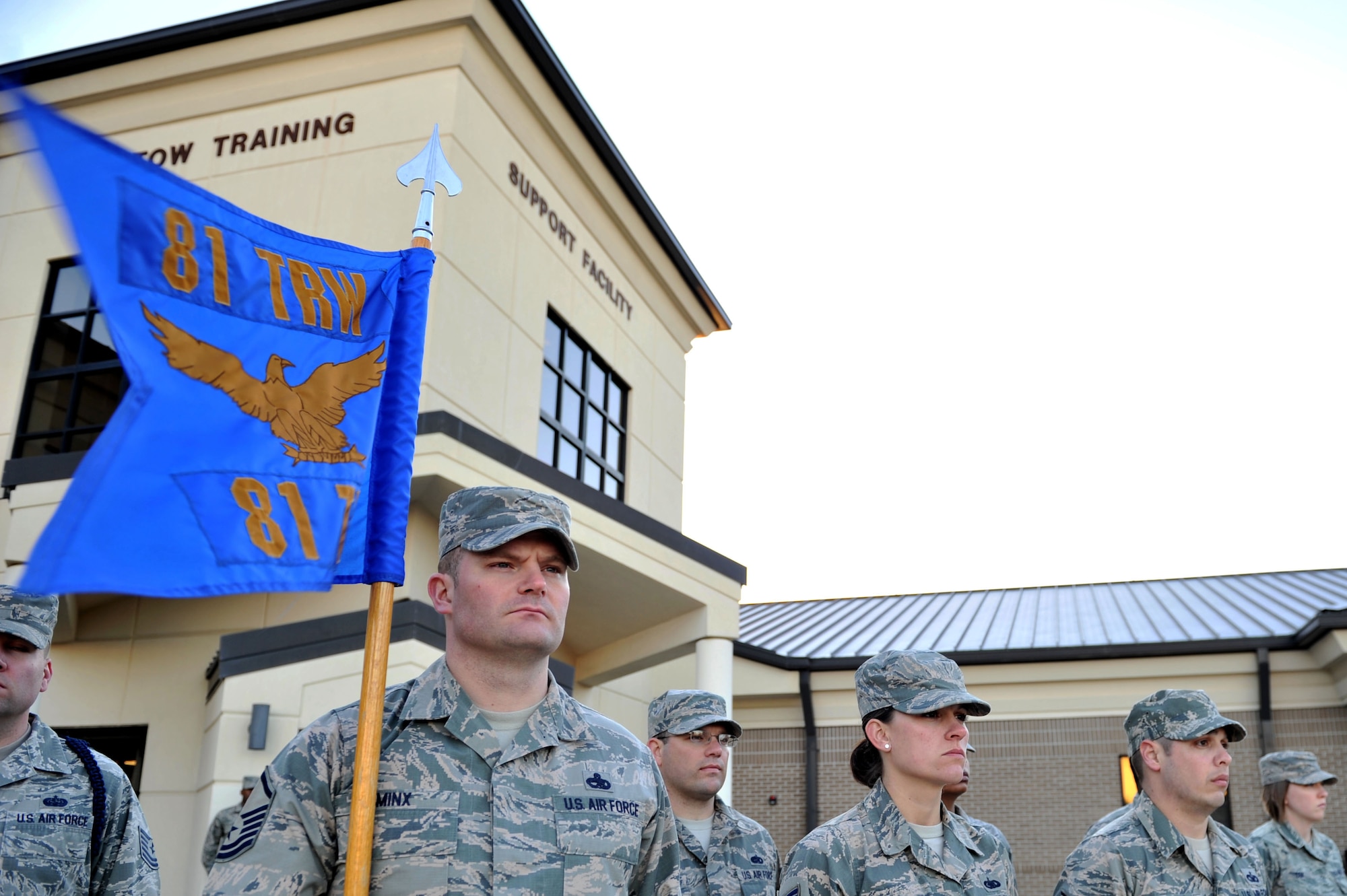 Master Sgt. Jacob Minx, 81st Training Support Squadron military training leader course student, holds the squadron guidon during a retreat ceremony, Feb. 4, 2016, Keesler Air Force Base, Miss. Minx and his classmates were selected to attend the nine-day course through the Developmental Special Duty program to learn how to mentor, train and lead Airmen in technical training as MTLs. (U.S. Air Force photo by Senior Airman Duncan McElroy)