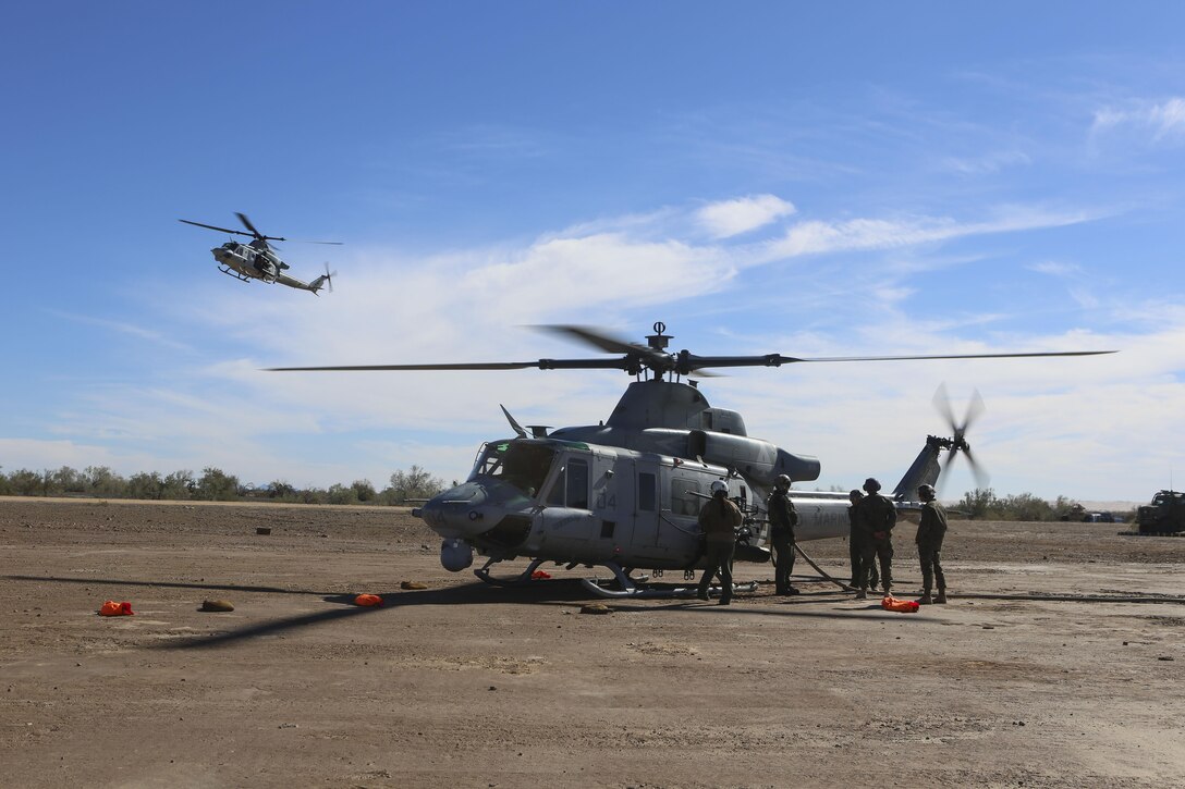 Marines with Marine Light Attack Helicopter Squadron (HMLA) 267 land a UH-1Y Huey to refuel during exercise Scorpion Fire 1-16 aboard Navy Air Facility El Centro, Calif., Jan. 25. HMLA-267 supported the exercise with close air support and live-fire capabilities, Jan. 25 to Feb. 5.