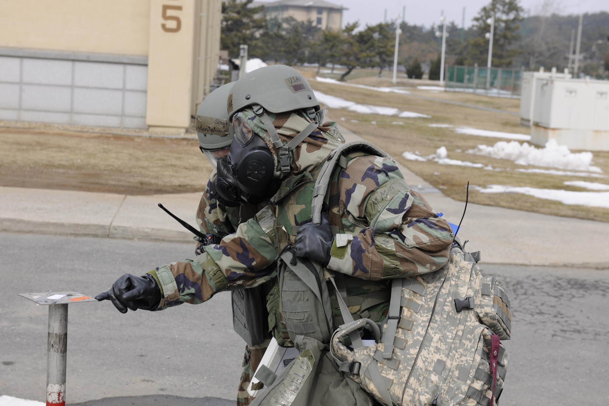 Airmen from the 8th Fighter Wing conduct a post attack reconnaissance sweep after a simulated ground attack during Beverly Pack 16-1, Feb. 4, 2016. The exercise was designed to test the readiness of Airmen with situations they would potentially encounter in a real-world wartime scenario. (U.S. Air Force photo by Senior Airman Dustin King/Released)