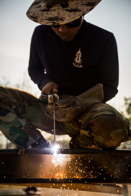 A service member with the Royal Thai Navy helps build a multi-purpose room at Ban Cham Kho School, in Rayong, Thailand, during exercise Cobra Gold, Feb. 4, 2016.  Cobra Gold 2016, in its 35th iteration, includes a specific focus on humanitarian civic action, community engagement, and medical activities conducted during the exercise to support the needs and humanitarian interests of civilian populations around the region.