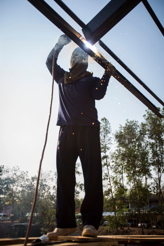 A service member with the Royal Thai Navy helps build a multi-purpose room at Ban Cham Kho School, in Rayong, Thailand, during exercise Cobra Gold, Feb. 4, 2016.  Cobra Gold 2016, in its 35th iteration, includes a specific focus on humanitarian civic action, community engagement, and medical activities conducted during the exercise to support the needs and humanitarian interests of civilian populations around the region.
