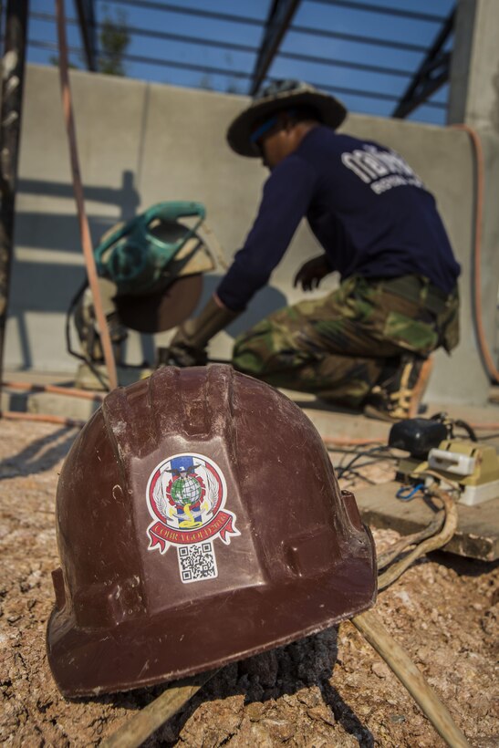 Service members with the Royal Thai Navy, Japan Ground Self-Defense Force and U.S. Marines help build a multi-purpose room at Ban Cham Kho School, in Rayong, Thailand, during exercise Cobra Gold, Feb. 4, 2016.  Cobra Gold 2016, in its 35th iteration, includes a specific focus on humanitarian civic action, community engagement, and medical activities conducted during the exercise to support the needs and humanitarian interests of civilian populations around the region.
