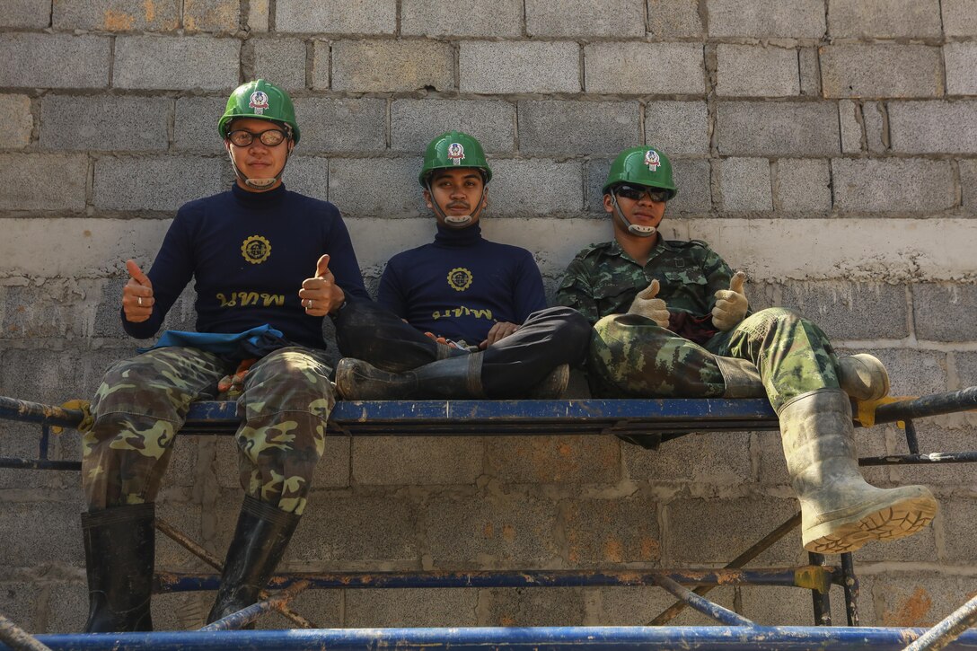 Service members from the Royal Thai Armed Forces pose for a photo during the building of a community center at Ban Sa Yai School, in Trat, Thailand, during exercise Cobra Gold, Feb. 3, 2016. Cobra Gold 2016, in its 35th iteration, includes a specific focus on humanitarian civic action, community engagement, and medical activities conducted during the exercise to support the needs and humanitarian interests of civilian populations around the region. 