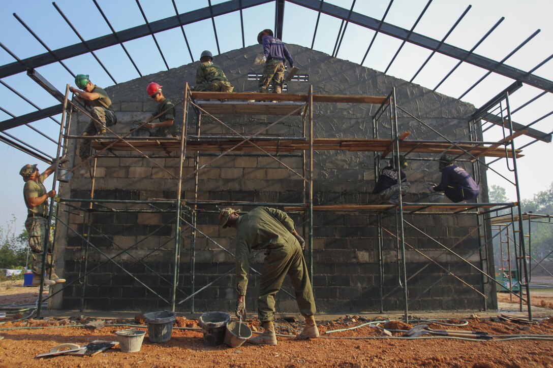 U.S. Marines work with Thai and Japanese service members to build a multipurpose room at Ban Cham Kho School in Rayong, Thailand, Feb. 4, 2016, during exercise Cobra Gold. Marine Corps photo by Sgt. William L. Holdaway