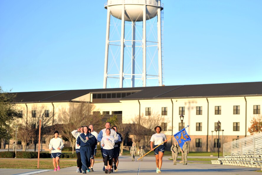 Staff, technical and master sergeants attending the 81st Training Support Squadron’s military training leader course run during a class physical training session around the 81st Training Group parade field Feb. 4, 2016, Keesler Air Force Base, Miss. NCOs selected via the Developmental Special Duty program attend the nine-day course, formerly based out of Joint Base San Antonio-Lackland, Texas, in order to mentor, train and lead Airmen in technical training as MTLs. This is the first class of future MTLs to attend the course at Keesler. (U.S. Air Force photo by Senior Airman Duncan McElroy)