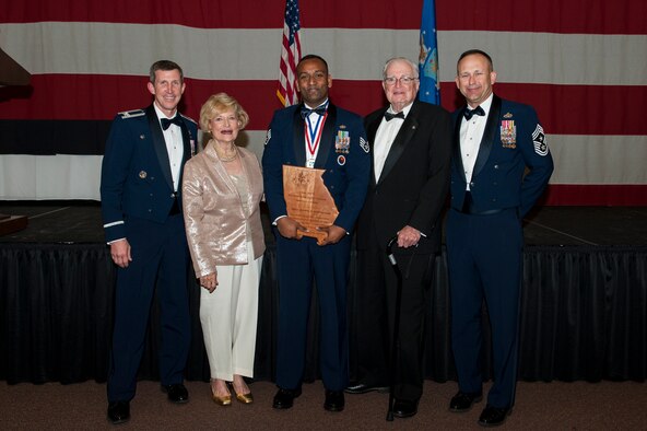 Staff Sgt. Joseph Jaganathan, 23d Mission Support Group Airman Leadership School instructor, poses with his 2015 Parker and Dr. Lucy Greene Service Award with Moody’s senior leaders during the 2015 Annual Awards Ceremony, Feb. 4, 2016, at Moody Air Force Base, Ga. Airmen must exemplify the Air Force core values, be highly engaged within the local community and be actively pursuing a higher education to qualify for the award. (U.S. Air Force photo by Airman 1st Class Lauren M. Johnson/Released)