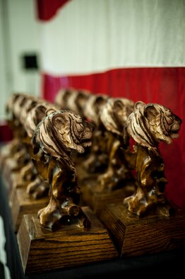 Flying tiger trophies rest on a display table during the 2015 Annual Awards Ceremony, Feb. 4, 2016, at Moody Air Force Base, Ga. Nominees for the annual awards were the top performers of 2015 and demonstrated the drive to be the best of the 23d Wing.  (U.S. Air Force photo by Airman 1st Class Lauren M. Johnson/Released)