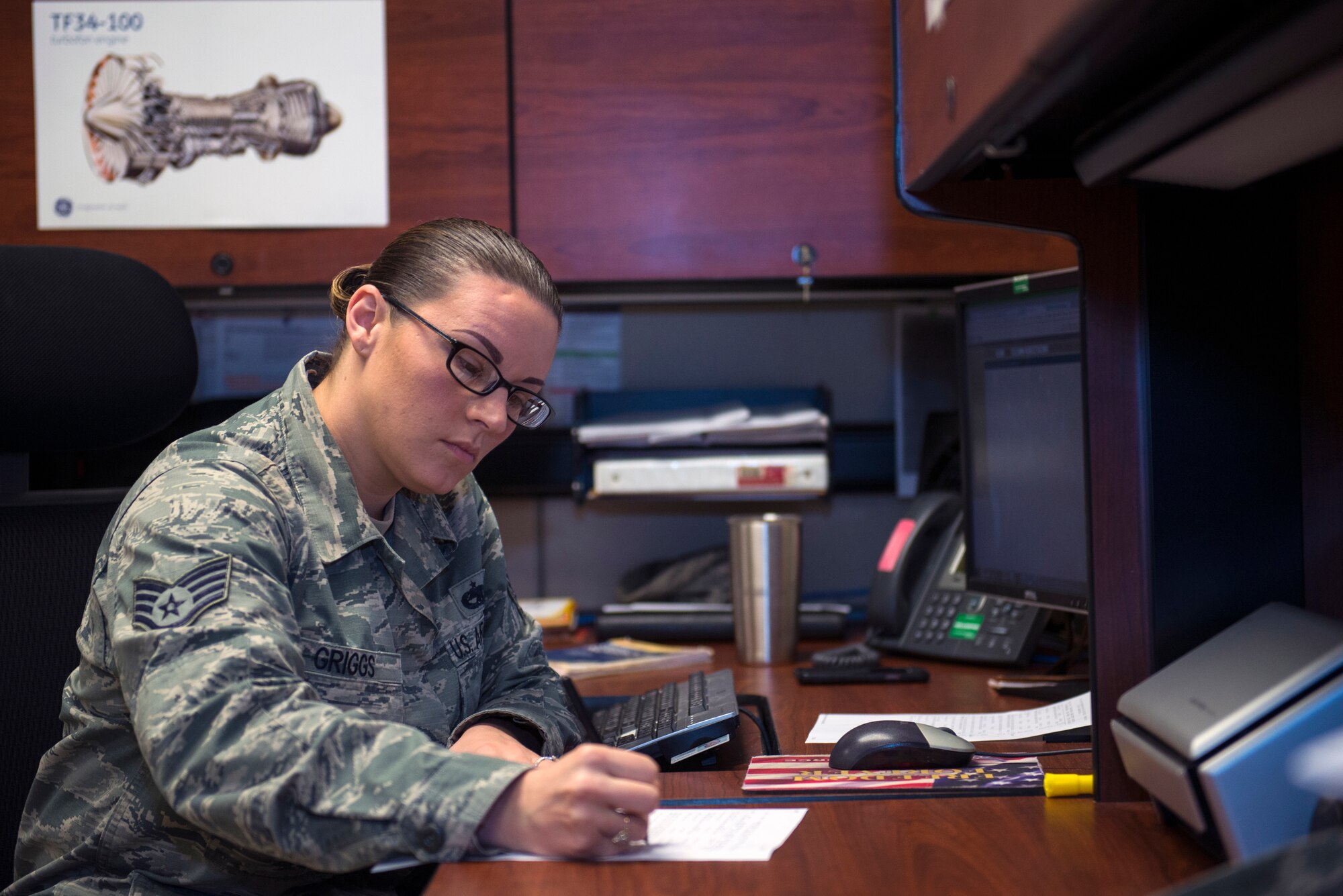 U.S. Air Force Staff Sgt. Amanda Griggs, 23d Maintenance Operations Flight engine management engine manager, documents debrief recap paperwork information, Feb. 5, 2016, at Moody Air Force Base, Ga. Griggs is responsible for viewing engine flight operations and performances that help determine possible additional maintenance based on engine performance. (U.S. Air Force photo by Airman 1st Class Greg Nash/Released) 