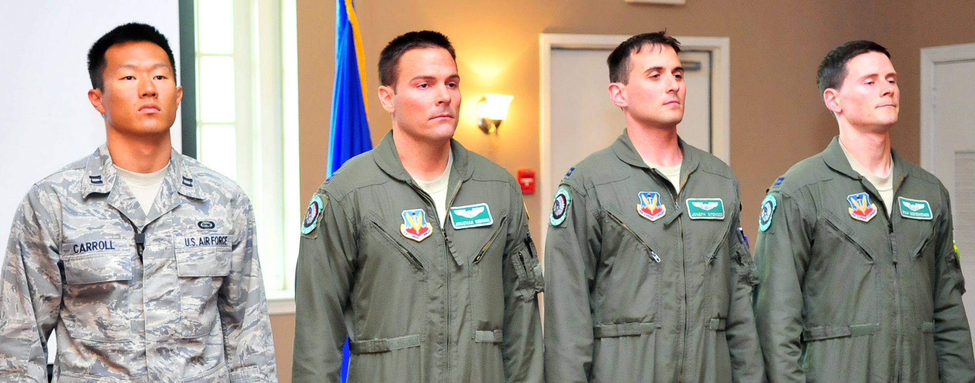 From left, Capts. Joshua Carroll, left, Jonathan Hudgins, Joseph Stenger, and Ryan Bodenheimer, wait to receive their Military Outstanding Volunteer Service Medal, April 18, 2012, at Seymour Johnson Air Force Base, North Carolina. While conducting combat operations in support of Operation Enduring Freedom, the Airmen dedicated more than 700 hours of personal time creating a non-profit organization, Flying Scarfs, to help impoverished Afghan women and children. (U.S. Air Force photo/Staff Sgt. Makenzie Lang)