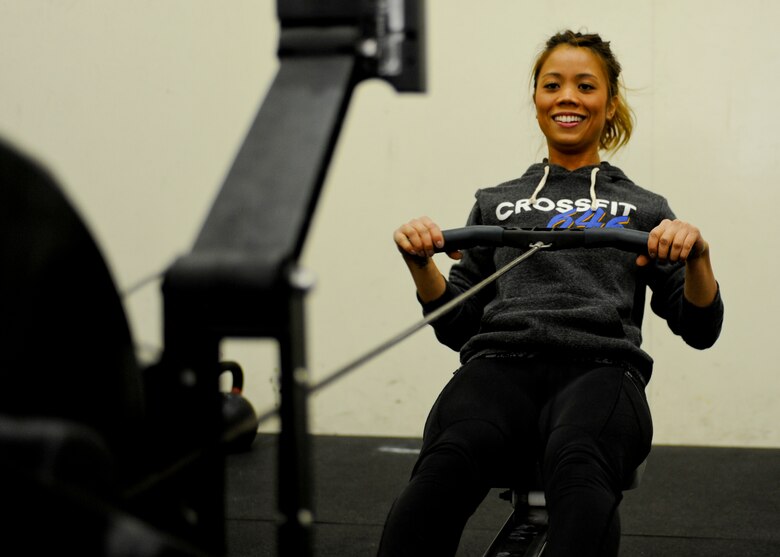 U.S. Air Force  Staff Sgt. Camille Galang, 355th Fighter Wing Command Post emergency action controller, exercises with a rowing machine at Davis-Monthan Air Force Base, Jan. 29, 2016. Galang felt the CrossFit program needed attention because they were having difficulties retaining coaches. She presented her idea to resolve the issue during the innovate DLT event. (U.S. Air Force photo by Airman Basic Nathan H. Barbour/Released)