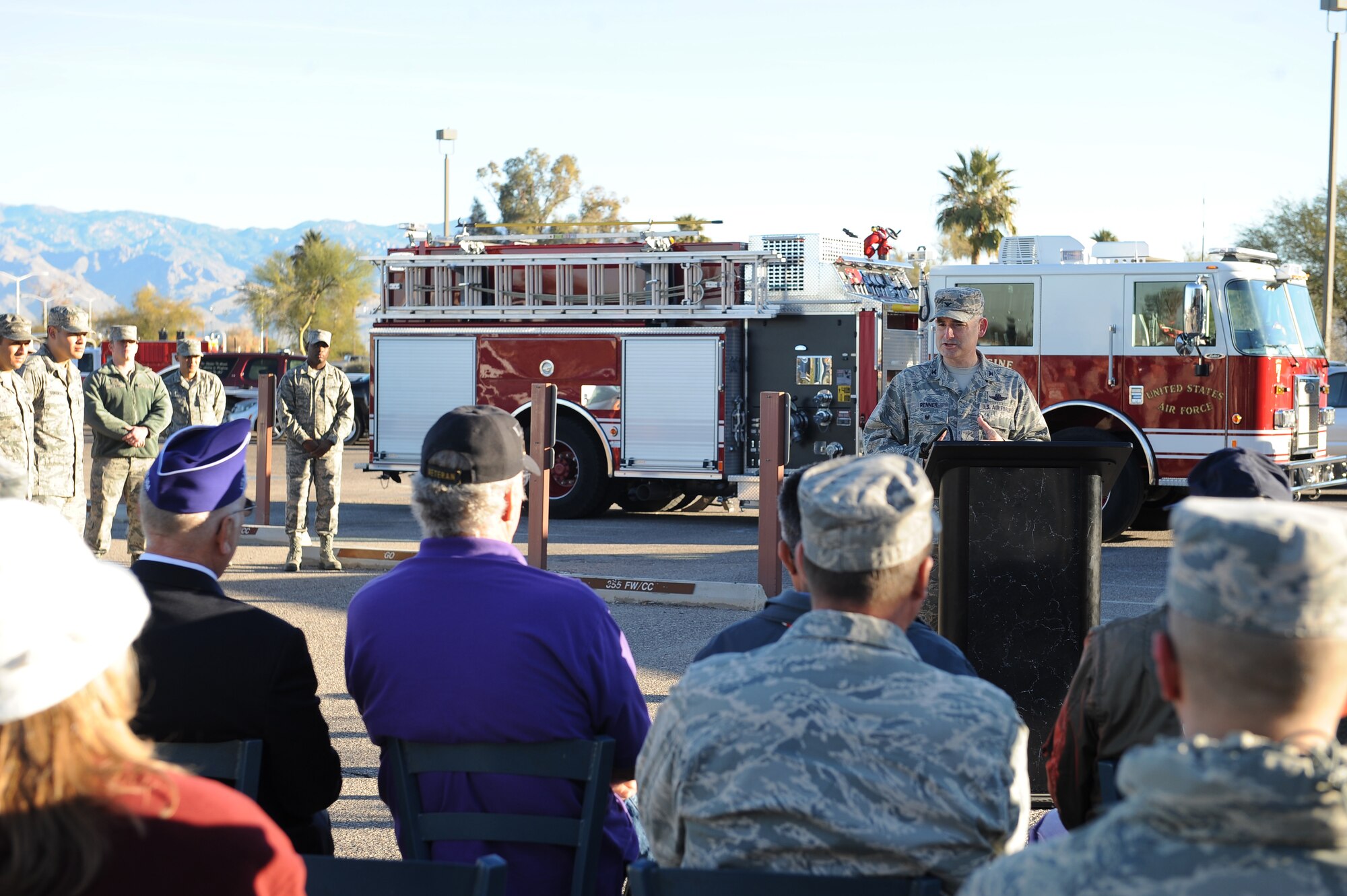 U.S. Air Force Col. Stephen Renner, 355th Fighter Wing vice commander, speaks during a Purple Heart recipient parking space dedication in the Exchange parking lot at Davis-Monthan Air Force Base, Ariz., Feb. 4, 2016. A sign was unveiled which marks a space reserved only for Purple Heart recipients. The space is closest to the entrance and adjacent from the Gold Star recipient parking space. (U.S. Air Force photo by Senior Airman Cheyenne A. Powers/Released)