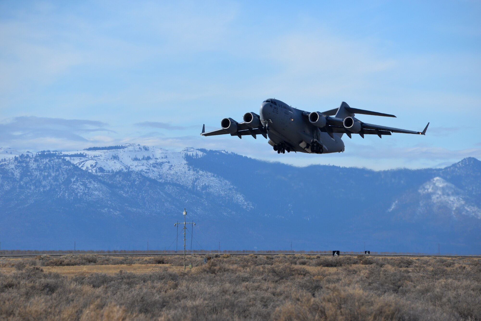 A C-17 Globemaster III assigned to Travis Air Force Base, Calif., performs a touch-and-go Jan. 21 at Amedee Army Airfield, Calif. (U.S. Air Force photo by Staff Sgt. Charles Rivezzo) 