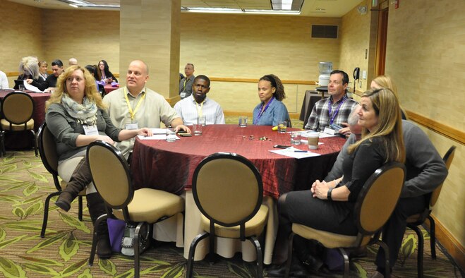 Air Force Reserve couples listen during the Yellow Ribbon Reintegration Program's initial Couples Enrichment Program class Jan. 30, 2015, in Denver. Unlike most courses offered during Yellow Ribbon, this training encompasses the entire weekend and encourages couples to focus on improving their relationships in a positive and productive manner. Chaplain (Maj.) Joshua Kim of the 459th Air Refueling Wing, Joint Base Andrews, Maryland, adapted the curriculum from the civilian course, Laugh Your Way to a Better Marriage, and led the instruction. (U.S. Air Force photo by Master Sgt. Megan Crusher) 