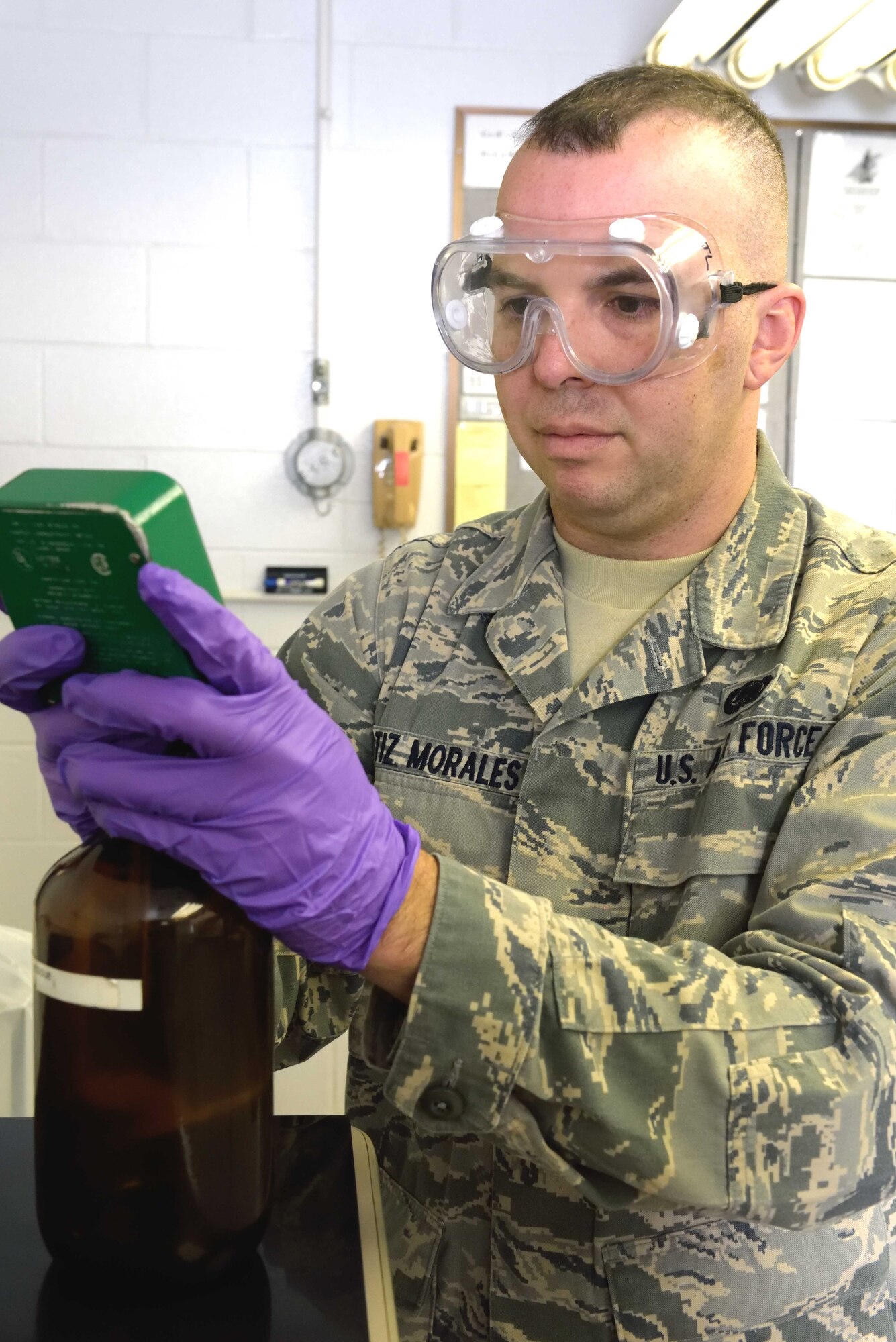 Senior Airman John Ortiz-Morales, 403rd Logistics Readiness Squadron fuels quality control specialist, uses a conductivity meter to measure the amount of static dissipator in a sample of Jet A fuel Jan. 9, 2016, at Keesler Air Force Base, Mississippi. Fuels quality control specialists are responsible for making sure the fuel used by U.S. Air Force aircraft is fit for flight. (U.S. Air Force photo/Tech. Sgt. Ryan Labadens)