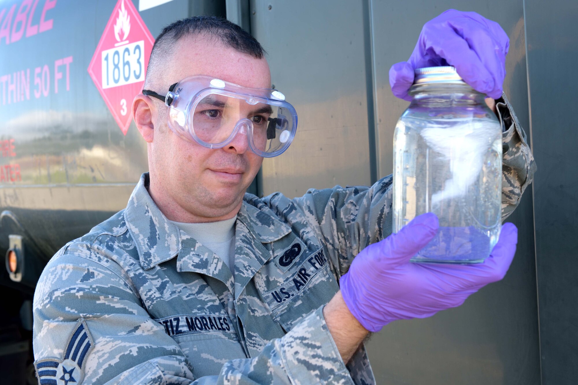 Senior Airman John Ortiz-Morales, 403rd Logistics Readiness Squadron fuels quality control specialist, takes a visual sample of Jet A fuel to look for contaminants like sediment and water Jan. 9, 2016, at Keesler Air Force Base, Mississippi. Fuels quality control specialists are responsible for making sure the fuel used by U.S. Air Force aircraft is fit for flight. (U.S. Air Force photo/Tech. Sgt. Ryan Labadens)