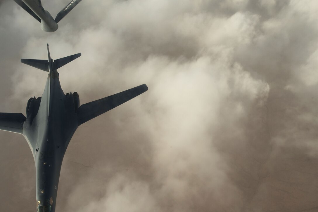 A B-1 bomber assigned to the 37th Expeditionary Bomb Squadron separates from the boom pod after receiving fuel from an Air National Guard KC-135 Stratotanker that is deployed to the 340th Expeditionary Air Refueling Squadron at Al Udeid Air Base, Qatar over Iraq, Sept. 16, 2015. (U.S. Air Force photo by Staff Sgt. Alexandre Montes/Released)