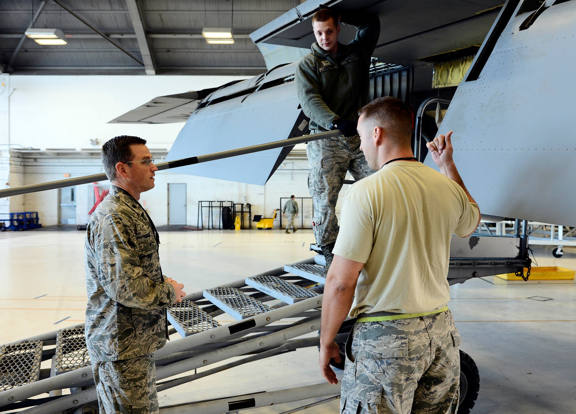 Lt. Col. Jeremy Harmon, deputy commander of the 6th Maintenance Group, talks with Airmen about a current isochronal inspection at MacDill Air Force Base, Fla., Jan. 21, 2016. Harmon received the 2015 Air Mobility Command Aircraft Maintenance Field Grade Manager award in January for his ability to align his team toward a common goal. (U.S. Air Force photo by Senior Airman Tori Schultz)  