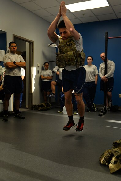 Airman 1st Class Jean Cruz, a response force member assigned to the 91st Missile Security Forces Squadron from Minot Air Force Base, N.D., was one of two competitors that completed the required 100 burpees during the quarterly Top Dog competition Jan. 27, 2016 at the McAdoo Fitness Center. Cruz competed in all eight exercises, which consisted of buddy carries, pushups, pull ups, bench press, squat, stationary row, dead lift and burpees. (U.S. Air Force photo/Airman 1st Class Jessica Weissman) 