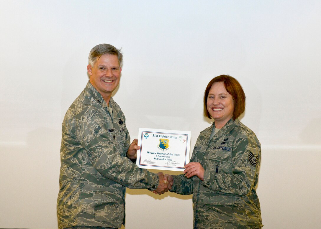 U.S. Air Force Tech. Sgt. Jessica Blace, 31st Fighter Wing Equal Opportunity NCO in charge, was named the 31st Fighter Wing’s “Wyvern Warrior of the Week,” during a wing staff meeting, Feb. 3, 2016, at Aviano Air Base, Italy. Blace was recognized by Col. Bryan Wolford, 31st Fighter Wing vice commander, for going above and beyond in her dedication to the mission. (U.S. Air Force photo by Airman 1st Class Cary Smith/Released)