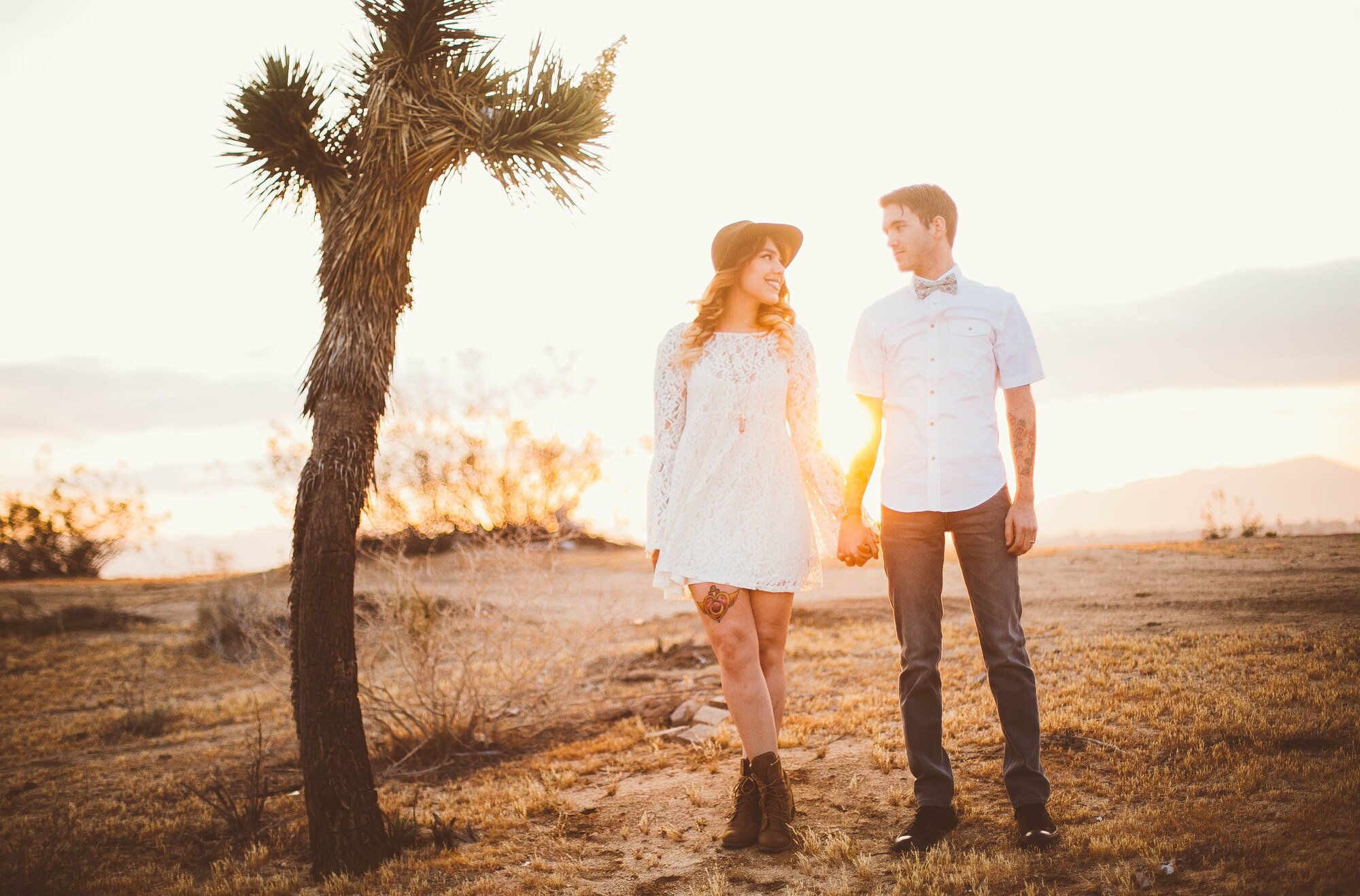 Senior Airman Mitch Rose, 48th Logistics Readiness Squadron customer service technician, and Erin, his wife, hold hands in Apple Valley, Calif., April 2015. Mitch and Erin met 11 years ago during a second period drama class in high school. (Courtesy photo from Kayla V. Photography)