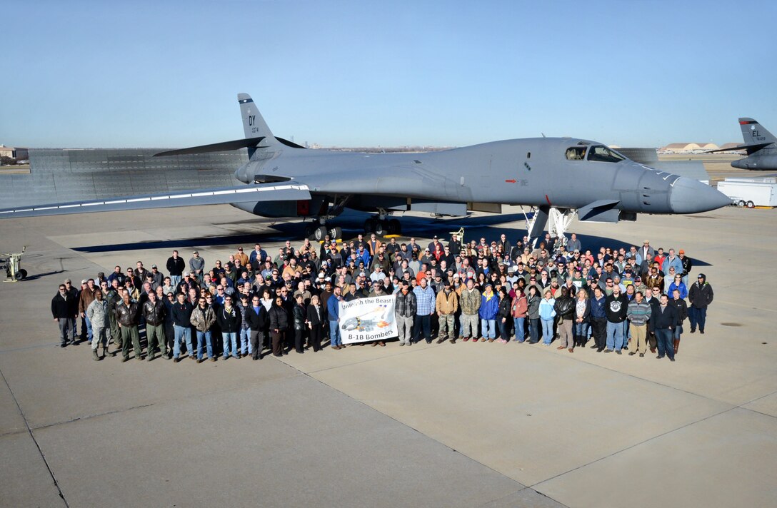 Before it leaves Tinker, members of the B-1 community pose with the 15th and final B-1B Bomber to receive the Integrated Battle Station modifications. (Air Force photo by Kelly White/Released)