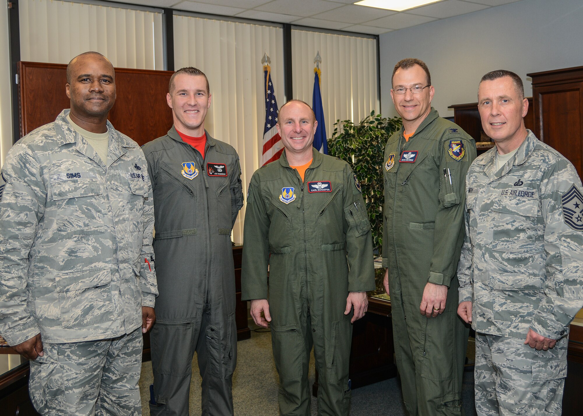From left to right: Air Force Assistance Fund installation points-of-contact Master Sgt. Robert Sims and Capt. Josh Coughenour pose for a photo with Brig. Gen. Carl Schaefer, 412th Test Wing commander; Col. David Radomski, 412th TW vice commander; and Chief Master Sgt. David Smith, 412th TW command chief, after they signed their AFAF donation slips Feb. 5. (U.S. Air Force photo by Rebecca Amber)