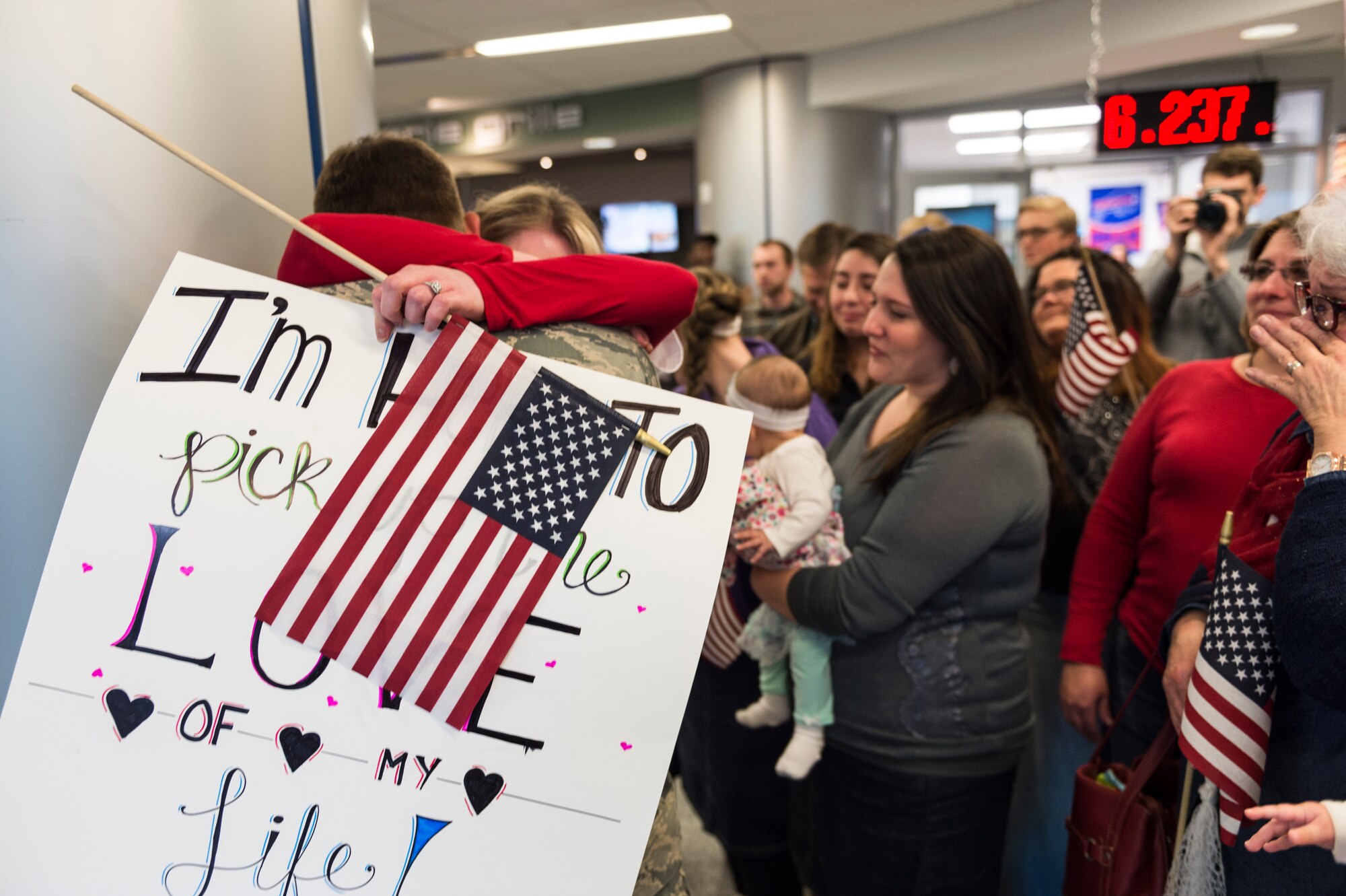 Families turned out to Buffalo Niagara International Airport to greet the more than 30 Airmen from the 107th Security Forces Squadron, Niagara Falls Air Reserve Station, N.Y., returning from a six-month deployment to Southwest Asia, Feb. 4-5, 2016. (U.S. Air National Guard photo by Staff Sgt. Ryan Campbell/Released)