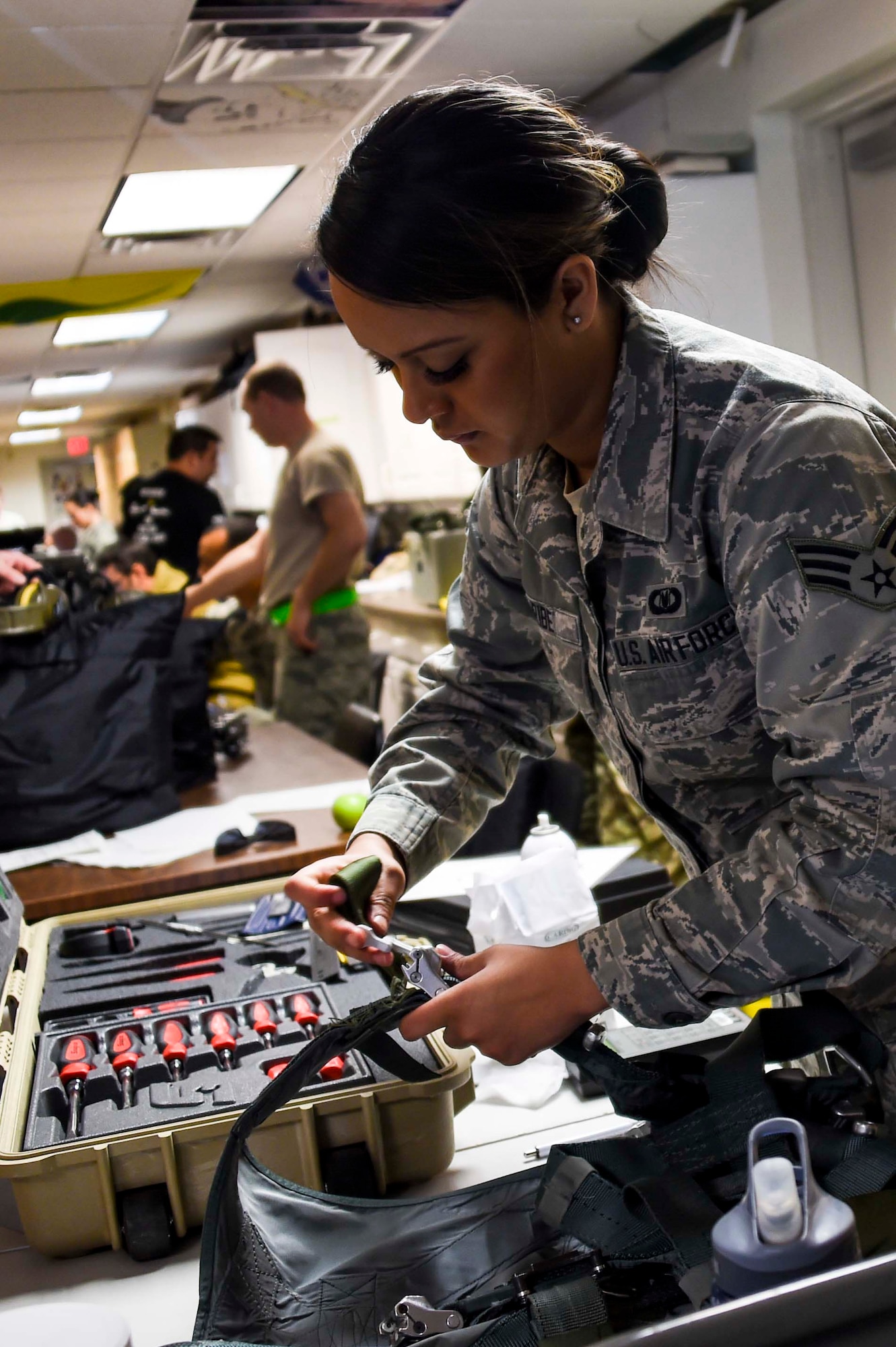 U.S. Air Force Senior Airman Alyssa Uribe, 144th Operations Group aircrew flight equipment technician, conducts a routine inspection on a harness as part of Red Flag 16-1 held at Nellis Air Force Base, Nev. Feb. 3, 2016. Uribe and the rest of the 144th OG AFE team complete thorough inspections on all the 194th Fighter Squadron pilots’ flight equipment before every mission to ensure the safest flight every time. (U.S. Air National Guard photo by Senior Airman Klynne Pearl Serrano)