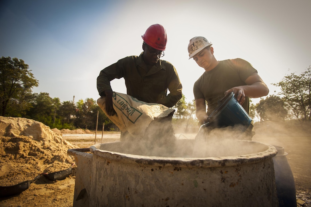 U.S. Marine Corps Lance Cpl. Jack Cyrone, left, and Lance Cpl. Tyler Cox, right, both combat engineers with the Marine Wing Support Squadron 171, help build a multipurpose room at the Ban Cham Kho School, in Rayong, Thailand, exercise Cobra Gold, Feb. 4, 2016. Cobra Gold 2016, in its 35th iteration, includes a specific focus on humanitarian civic action, community engagement and medical activities conducted during the exercise to support the needs and humanitarian interests of civilian populations around the region.