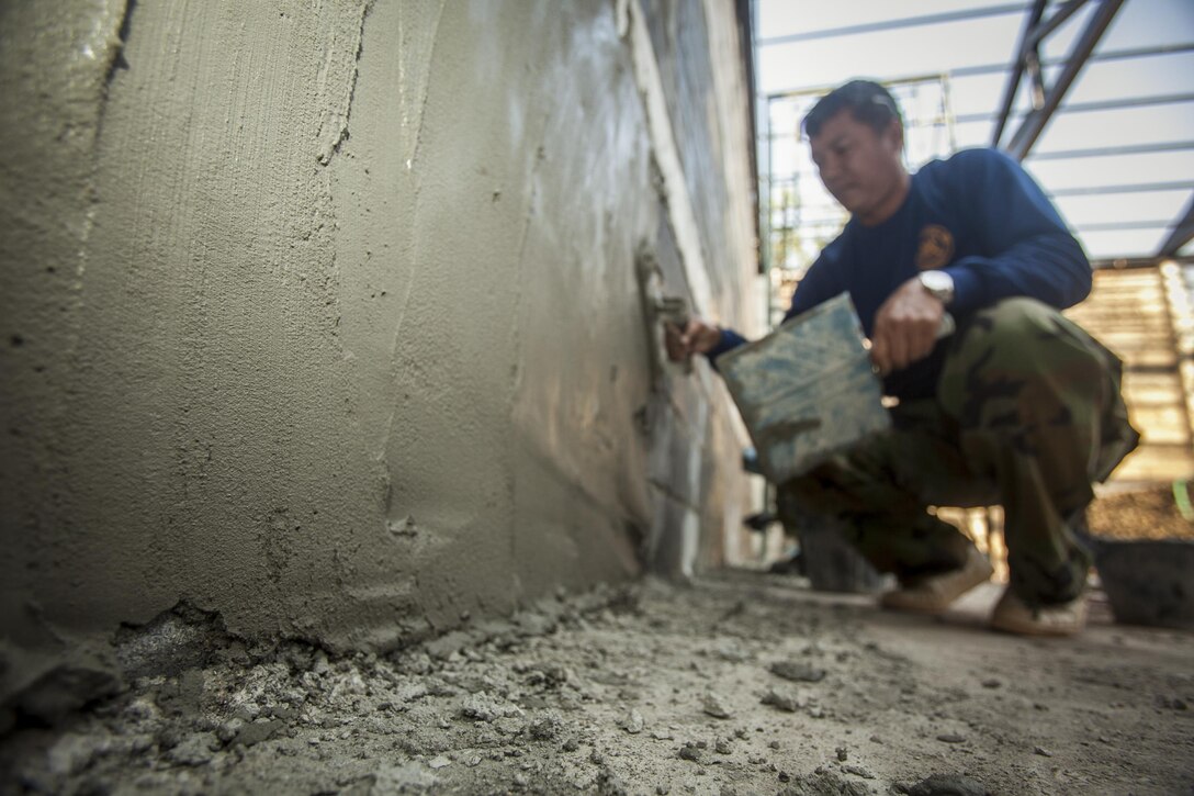 A service member with the Royal Thai Navy helps build a multipurpose room at the Ban Cham Kho School, in Rayong, Thailand, exercise Cobra Gold, Feb. 4, 2016. Cobra Gold 2016, in its 35th iteration, includes a specific focus on humanitarian civic action, community engagement and medical activities conducted during the exercise to support the needs and humanitarian
interests of civilian populations around the region.