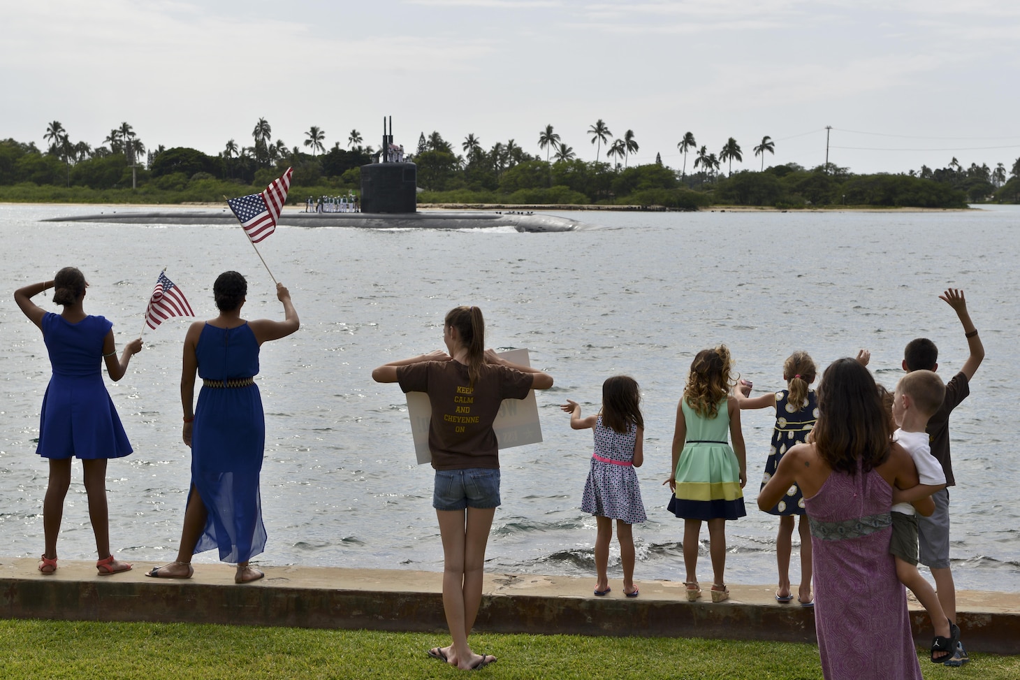 160205-N-LY160-016 PEARL HARBOR (Feb. 5, 2016) Family and friends cheer the return of the crew aboard the Los Angeles-class fast-attack submarine USS Cheyenne (SSN 773). USS Cheyenne returned to Pearl Harbor after completing a successful 5-month deployment to the western Pacific Ocean. (U.S. Navy photo by Mass Communication Specialist 2nd Class Michael H. Lee/Released)