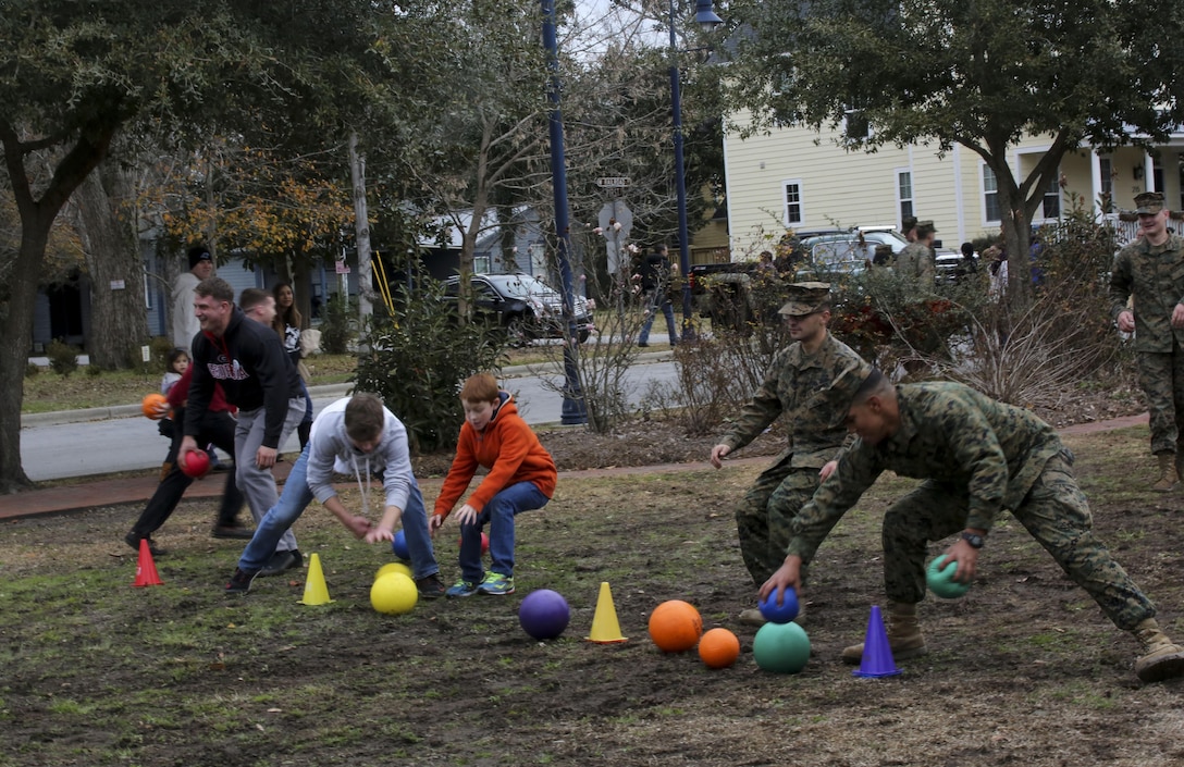 Marines with 2nd Marine Division play a game of dodgeball alongside community members following the Division’s 75th anniversary parade in downtown Jacksonville, N.C., Feb. 6, 2016. The celebration serves as a time to remember the Marines and sailors who served and continue to serve in 2nd Marine Division, while thanking the local community for their support. (U.S. Marine Corps photo by Cpl. Paul S. Martinez/Released)
