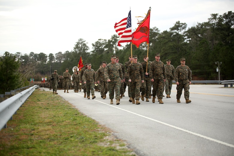 2nd Marine Division’s senior leaders form the front ranks of the unit’s 75th anniversary parade through downtown Jacksonville, N.C., Feb. 6, 2016. (From left to right) Col. Barry J. Fitzpatrick Jr., chief of staff; Maj. Gen. Brian D. Beaudreault, commanding general; Sgt. Maj. David Bradford, sergeant major; and Master Chief Petty Officer Russell W. Folley, command master chief. The celebration serves as a time to remember the Marines and sailors who served and continue to serve in 2nd Marine Division, while thanking the local community for their support. (U.S. Marine Corps photo by Cpl. Joey Mendez/Released)