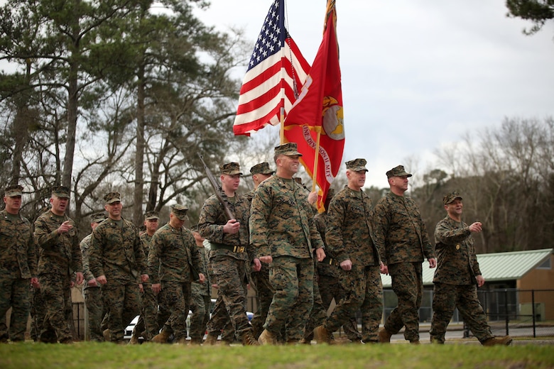 Maj. Gen. Brian D. Beaudreault, commanding general of 2nd Marine Division, and fellow leaders of the unit point and smile at friends and family during the unit’s 75th anniversary parade in downtown Jacksonville, N.C., Feb. 6, 2016. The celebration serves as a time to remember the Marines and sailors who served and continue to serve in 2nd Marine Division, while thanking the local community for their support. (U.S. Marine Corps photo by Cpl. Joey Mendez/Released)