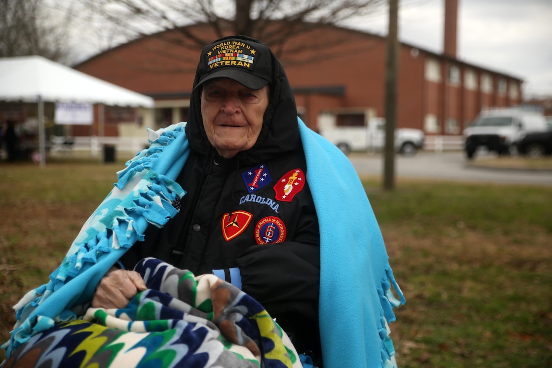 Retired Gunnery Sgt. Raoul Gagnon, a World War II, Korean War and Vietnam War veteran, watches the 2nd Marine Division’s 75th anniversary parade in downtown Jacksonville, N.C., Feb. 6, 2016. The celebration serves as a time to remember the Marines and sailors who served and continue to serve in 2nd Marine Division, while thanking the local community for their support. (U.S. Marine Corps photo by Cpl. Joey Mendez/Released)
