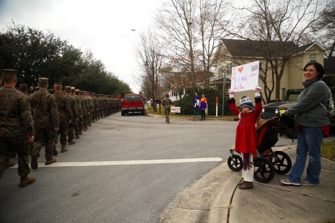 A young girl displays a sign to show support for 2nd Marine Division during the unit’s 75th anniversary parade in downtown Jacksonville, N.C., Feb. 6, 2016. The celebration serves as a time to remember the Marines and sailors who served and continue to serve in 2nd Marine Division, while thanking the local community for their support. (U.S. Marine Corps photo by Cpl. Joey Mendez/Released)