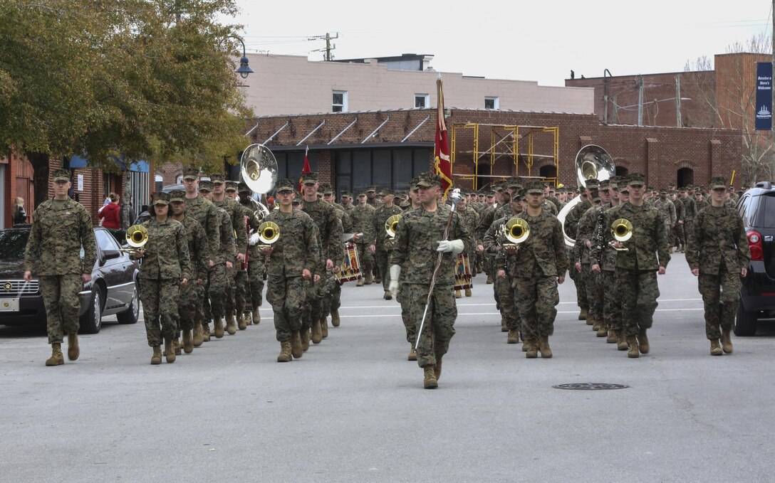 The 2nd Marine Division Band enters Riverwalk Crossing Park during the 2nd Marine Division’s 75th anniversary parade in downtown Jacksonville, N.C., Feb. 6, 2016. The celebration serves as a time to remember the Marines and sailors who served and continue to serve in 2nd Marine Division, while thanking the local community for their support. (U.S. Marine Corps photo by Cpl. Paul S. Martinez/Released)