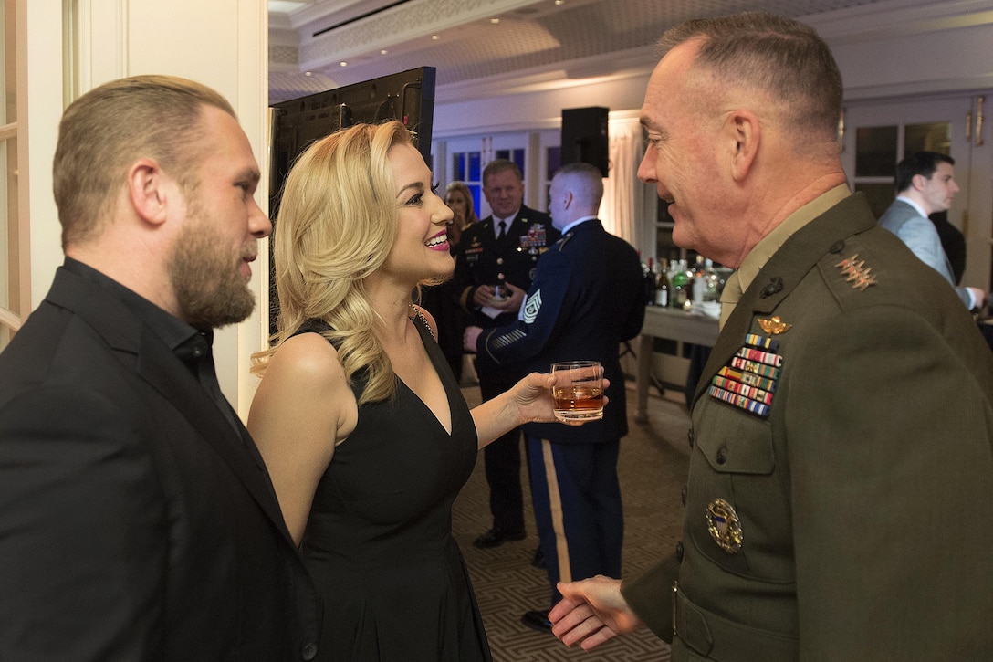 Marine Corps Gen. Joseph F. Dunford Jr., right, chairman of the Joint Chiefs of Staff, speaks with country music singer Kellie Pickler and her husband, country music songwriter Kyle Jacobs, at the USO 75th anniversary reception in Washington, D.C., Feb. 4, 2016. Dunford delivered keynote remarks at the event. Other attendees included Dr. Jill Biden, actor Dennis Haysbert, and “Jeopardy!” host Alex Trebek. DoD photo by Navy Petty Officer 2nd Class Dominique A. Pineiro