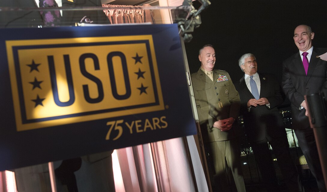 Marine Corps Gen. Joseph F. Dunford Jr., left, chairman of the Joint Chiefs of Staff, shares a light moment with retired Army Gen. George W. Casey Jr., center, the 36th Army chief of staff and current chairman of the USO board of governors, and USO President and CEO J.D. Crouch II during the USO 75th anniversary reception in Washington, D.C., Feb. 4, 2016. DoD photo by Navy Petty Officer 2nd Class Dominique A. Pineiro